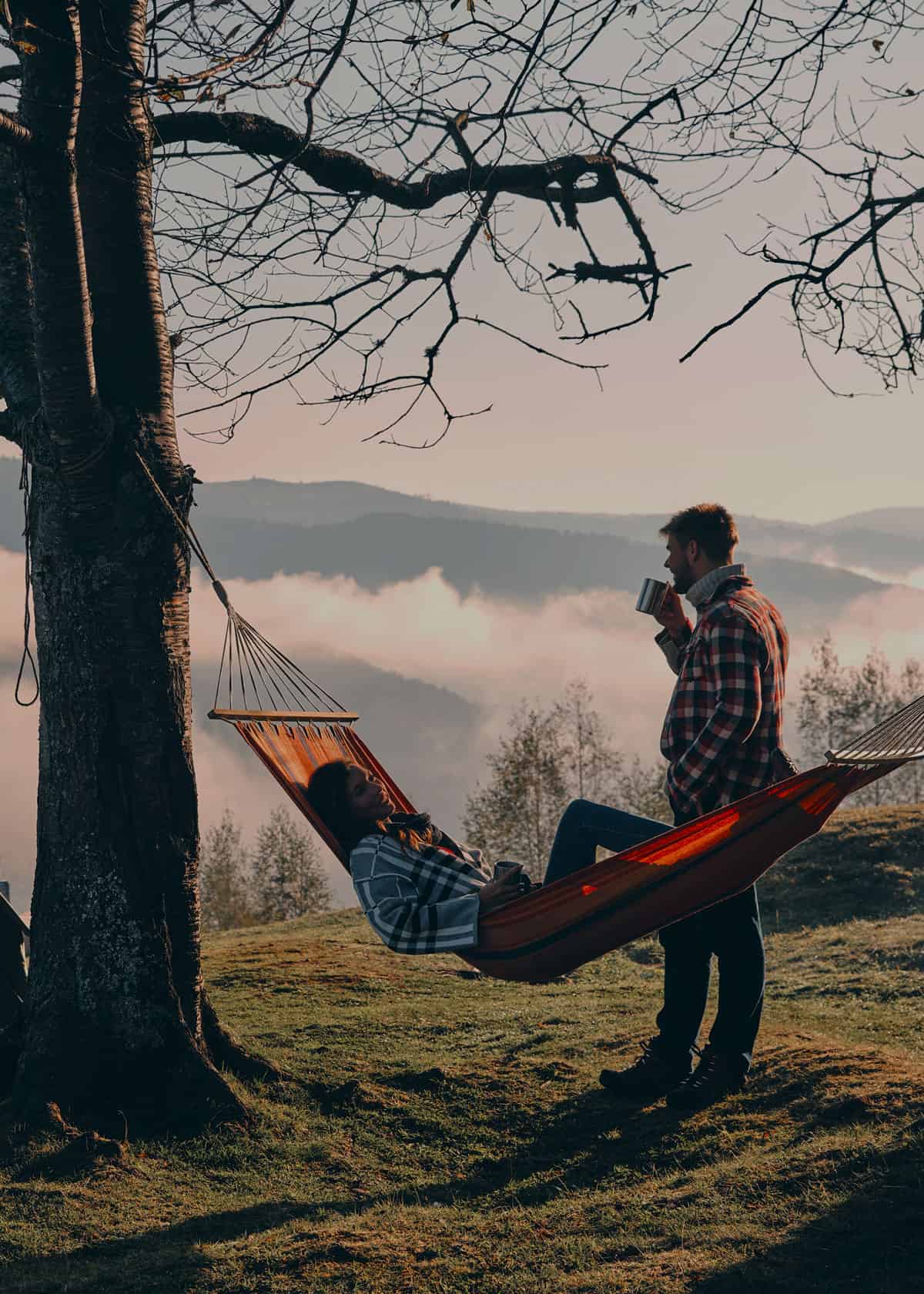 Couple camping with a hammock